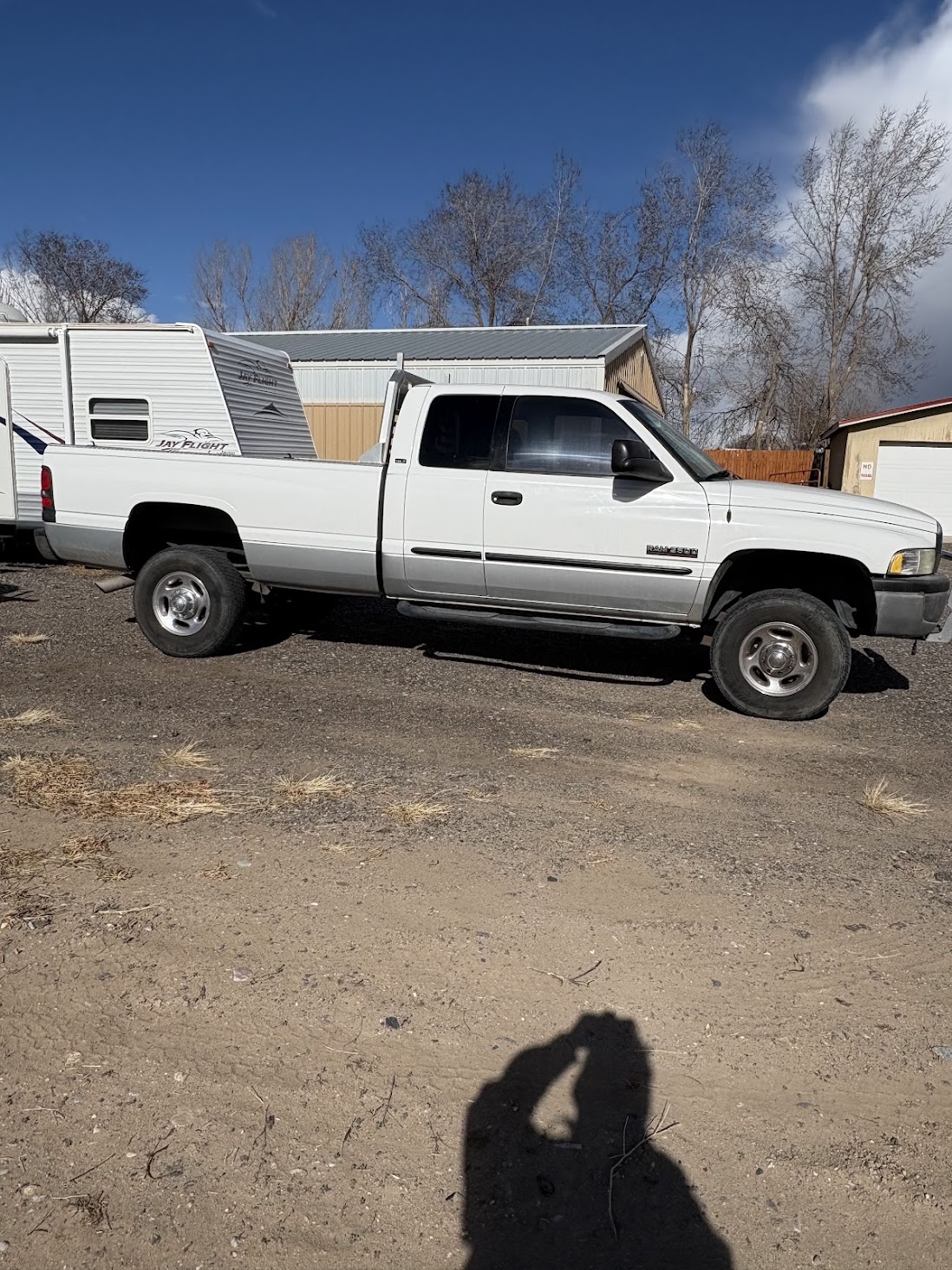 Passenger-side view of the white Dodge Ram 2500